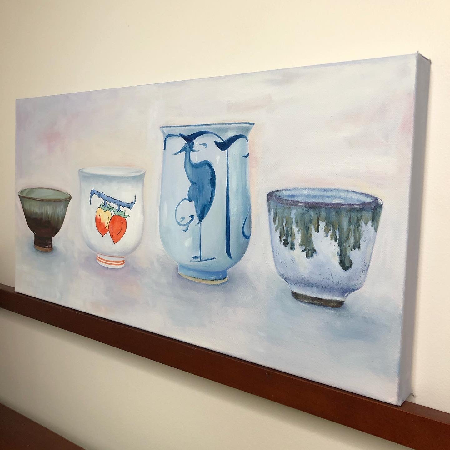 still life oil painting of four traditional Japanese ceramic sake cups from side view